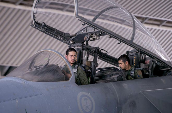 In this photo released Sept. 24, by the official Saudi Press Agency, Saudi pilots sits in the cockpit of a fighter jet as part of U.S.-led coalition airstrikes on Islamic State militants and other targets in Syria that began early Sept. 23 in Saudi Arabia. U.S. Arab allies Egypt, Saudi Arabia, the United Arab Emirates and Kuwait are discussing creation of a military pact to take on Islamic militants, with the possibility of a joint force to intervene around the Middle East, The Associated Press has learned. Even if no joint force is agreed on, the alliance would coordinate military action, aiming at quick, pinpoint operations against militants rather than longer missions, officials said.