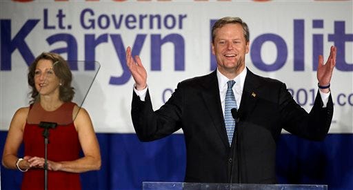 Massachusetts Republican gubernatorial candidate Charlie Baker, the declared winner in his race against Attorney General Martha Coakley, addresses supporters at his election night event early Wednesday, Nov. 5, 2014, in Boston. Baker's wife Lauren Baker stands next to him.