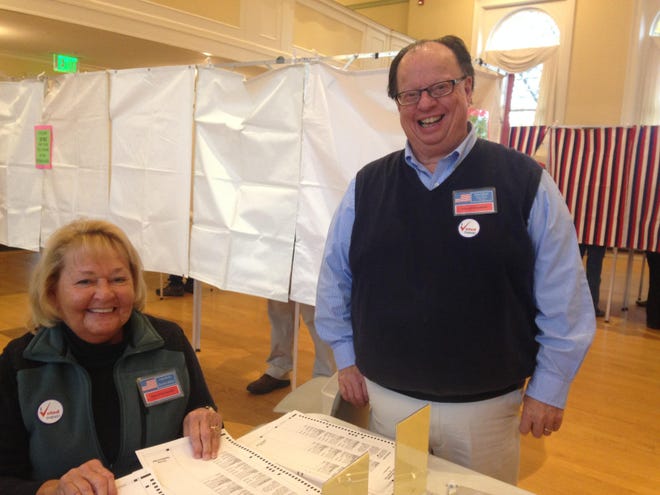 Election clerk Linda Johnson and Town Clerk Merton Brown preside over a busy polling place at Kennebunk Town Hall on Tuesday.