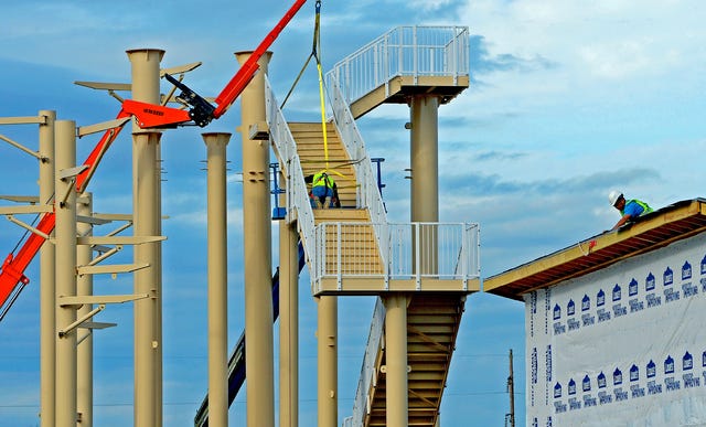 BRIAN D. SANDERFORD • TIMES RECORD Work continues on buildings and the steps that will lead to the top of the water slides at the aquatics center in Ben Geren Regional Park on Monday, Nov. 3, 2014. The facility is scheduled to open for business on Memorial Day weekend.