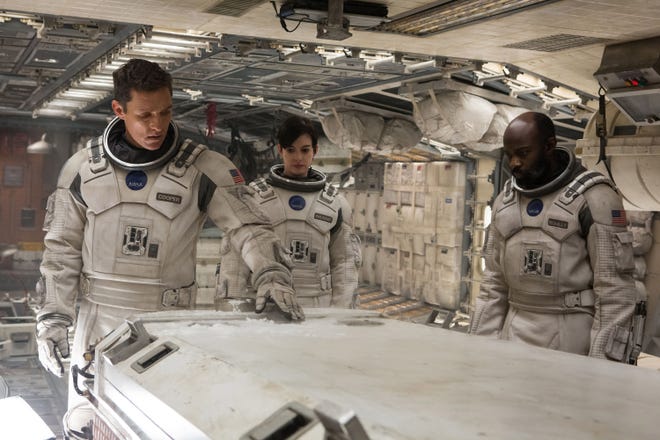 From left, Matthew McConaughey, Anne Hathaway, and David Gyasi appear in "Interstellar" from Paramount Pictures and Warner Brothers Entertainment.