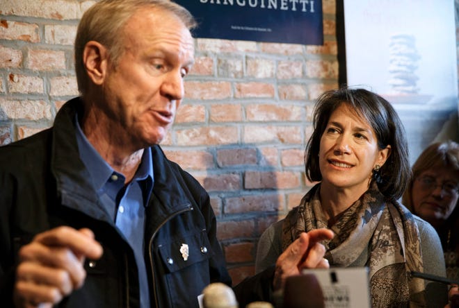 Diana Rauner listens as her husband, Republican Governor-elect Bruce Rauner, speaks to the crowd gathered at Cafe Moxo in Springfield Friday, Nov. 7, 2014. Ted Schurter/The State Journal-Register