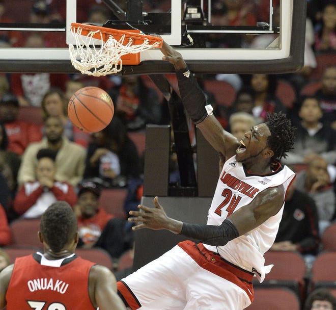 FILE - In this Oct. 19, 2014, file photo, Louisville's Montrezl Harrell, right, dunks as teammate Chinanu Onuaku looks on during the first half of an NCAA college basketball scrimmage in Louisville, Ky. Harrell was selected to The Associated Press' preseason All-America NCAA college basketball team Monday, Nov. 3, 2014.