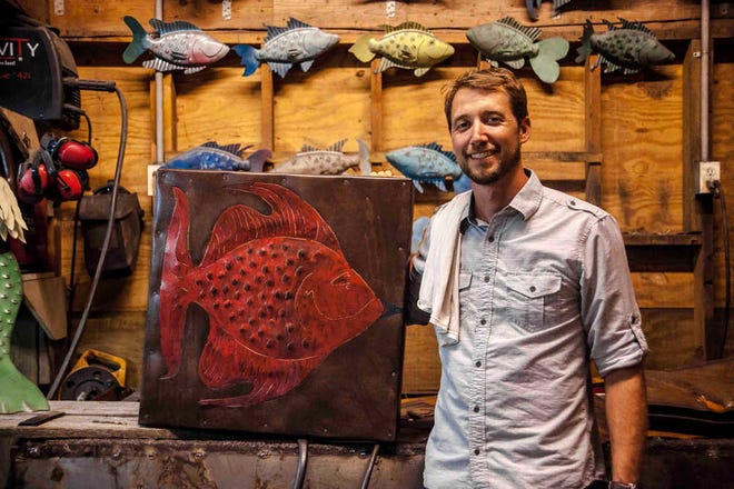 Artist Chase Allen stands with a metal fish sculpture at his South Carolina workshop. Allen will be traveling to New York City after winning the Audience Choice Award in the 2014 Martha Stewart American Made Awards competition. (Photo special to the Savannah Morning News)