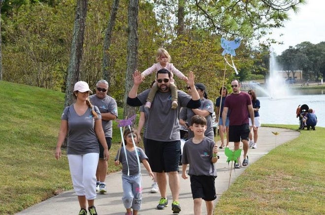 More than 200 people walk during the Tears Foundation's Rock and Walk event Saturday to remember Florida infants who have died over the years.
