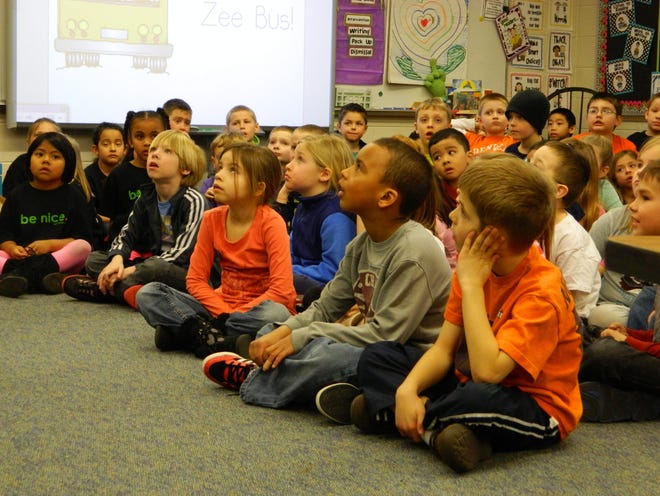 First graders from Zeeland's New Groningen Elementary School listen to a presentation in this file photo. The school is one that officials want to add on to with a potential bond proposal. File photo/Sentinel Staff