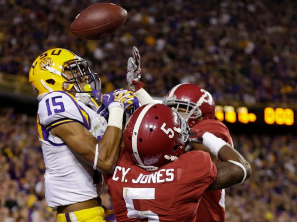 Alabama’s Cyrus Jones and Jabriel Washington break up a pass intended for LSU’s Malachi Dupre on the last play of Saturday’s 20-13 overtime victory by the Crimson Tide. (Gerald Herbert | Associated Press)
