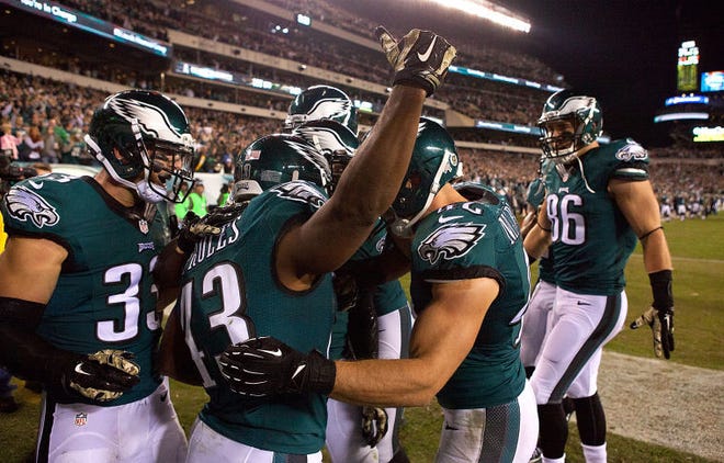 Philadelphia Eagles RB Darren Sproles (second from left) scores a TD after a 65 yard punt return in the first quarter of a game against the Carolina Panthers at Lincoln Financial Field in Philadelphia Monday night.