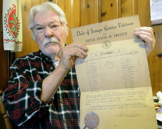Windell Bogges of Rochester displays the original charter for The Dads of Foreign Service Veterans of the United States of America, which was signed Dec. 1, 1949.