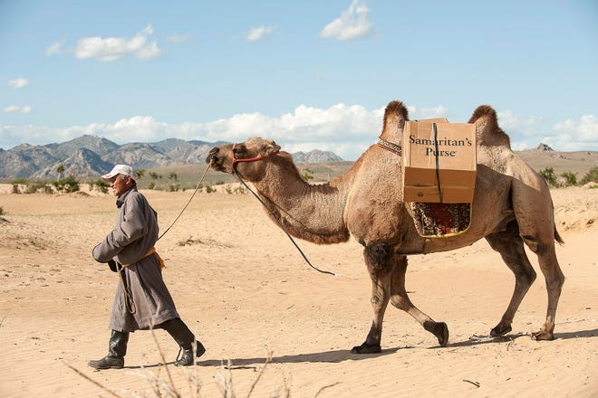 A man delivers Samaritan's Purse presents via camel. COURTESY PHOTO