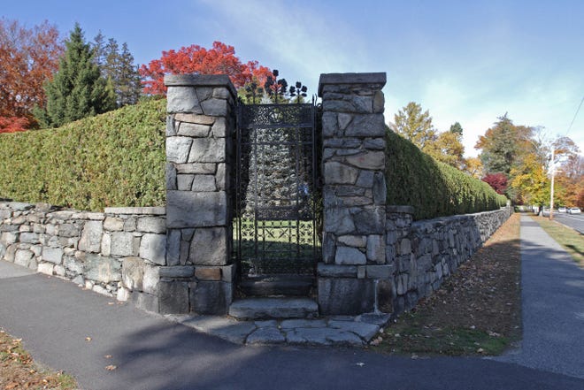 Owners want to divide the historic Bridgham Estate at the corner of Blackstone Boulevard and Rochambeau Avenue into house lots. The stone wall bears an inscription that dates to 1849, when it bordered an old farm.