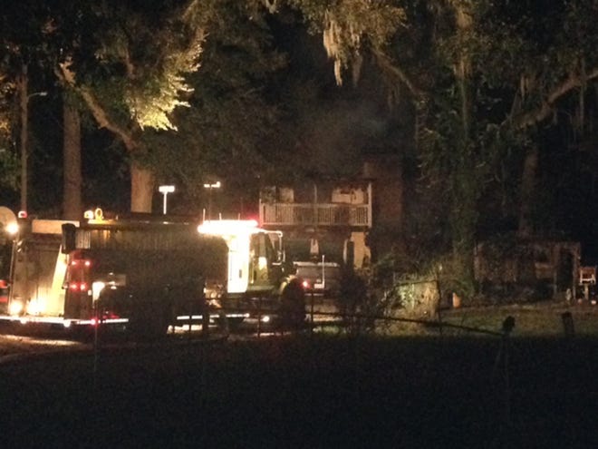 Fire crews battled a house fire on Salt Creek Road Monday night. No one was home at the time of the blaze. (Katie Martin/Savannah Morning News)