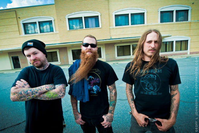 Jonathan Anthon (center), bass player for the heavy metal band Black Tusk, died after being critically injured in a weekend motorcycle crash near his home in Georgia. (Photo: Geoff L. Johnson)