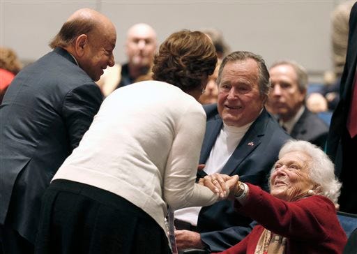 Barbara Bush, right, and former President George H.W. Bush greet friends at his presidential library before their son George W. Bush discussed his new book, "41: A Portrait of My Father" Tuesday, Nov. 11, 2014, in College Station, Texas. (AP Photo/Texas Tribune, Bob Daemmrich, Pool)