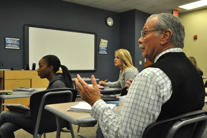 U.S. Navy veteran Jeffrey Widmann asks a question of the instructor in his Monday statistics class at Daytona State College. At age 72, the Vietnam veteran is studying for a degree with a focus on psychology.