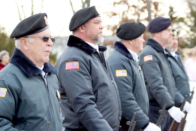 A salute from the VFW Honor Guard was held Tuesday during the Veterans Day program. From left, Tom Reed, Nate Pendleton, Dave Smithwick and Dave Holdsworth.