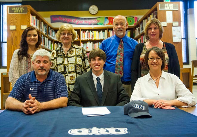Evans' Seth Carter is flanked by his parents Ron and Adrienne Carter, sister Hollie Carter (back left) and grandparents Frieda Carter and David and Cheryl Taylor.
