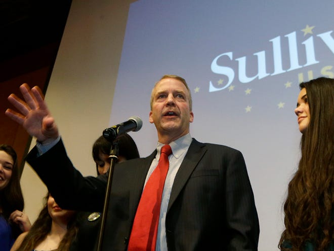 Republican U.S. Senate candidate Dan Sullivan greets supporters on Nov. 4 in Anchorage Alaska as his daughter Meghan looks on at right. Sullivan is challenging U.S. Sen. Mark Begich, D-Alaska. The contest was too close to call on Election Night, with Sullivan up by about 8,100 votes, but it became evident Tuesday when the state began counting about 20,000 absentee and questioned ballots that Begich could not overcome his opponent.