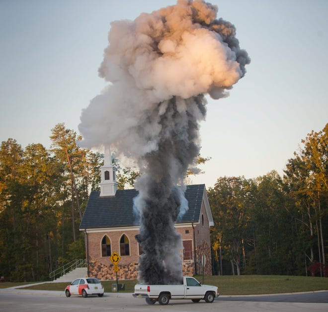A truck with an explosive is detonated on a street during a US Diplomatic Security Service High Threat training program held at a mock town named Erehwon, "nowhere" spelled backwards, on a rural Virginia military base, Thursday, Oct. 9, 2014. Two years after the deadly attack on a U.S. facility in Benghazi, Libya, the Diplomatic Security Service that is responsible for protecting some 100,000 Americans around the world has dramatically expanded training. (AP Photo/Pablo Martinez Monsivais)