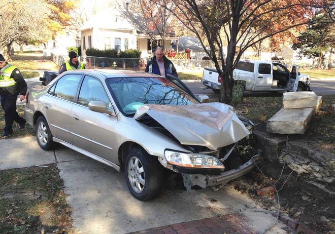 No injuries were reported in a 2-vehicle crash that sent a Honda Accord over the curb and into a stone retaining wall at the southeast corner of S.W. 5th and Taylor.