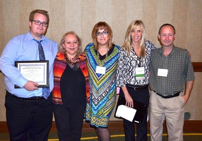 The staff of LifeWays A.R.E. Drop-In Centers in Jackson and Hillsdale recently received recognition, winning the Richard Wellwood Award. They are pictured with Maribeth Leonard, LifeWays CEO (fourth from left). COURTESY PHOTO