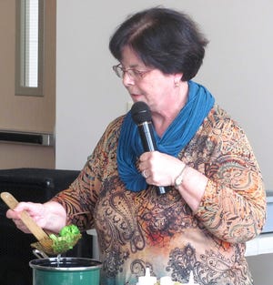 Mary Houchen shows members of the Hillsdale Women's Club how to make blanch broccoli during a recent meeting. COURTESY PHOTO