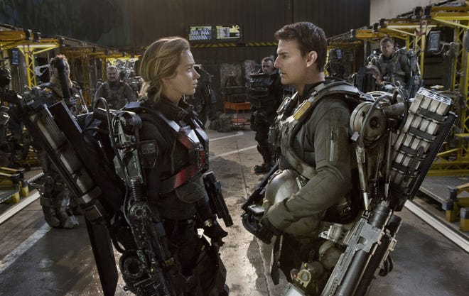 Emily Blunt and Tom Cruise star as futuristic soldiers in the sci-fi thriller "Live Die Repeat: Edge of Tomorrow."