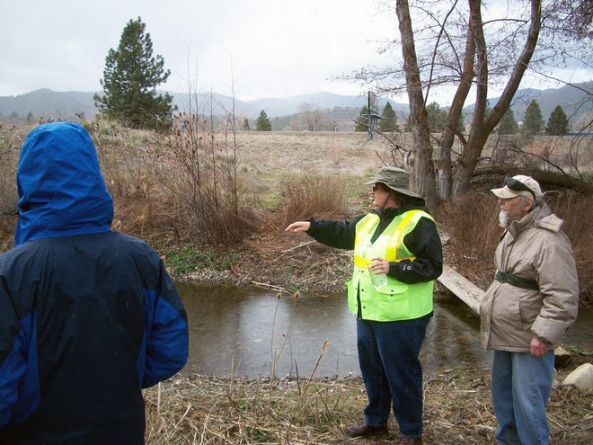 Jeannette Hook of Yreka City Hall shows the public the Oberlin Yreka Creek site at last year's riparian walk.