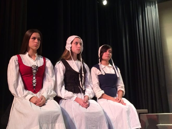 Photos by Emily Hatstat/Special to Advocate

Bethany Fernandes, Alyssa Botelho and Olivia Esteireiro wear Puritan garb during a dress rehearsal for Arthur Miller's play, 'The Crucible.'