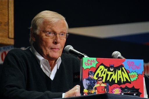 FILE-- In this Oct. 9, 2014 photo provided by courtesy of Warner Bros. Home Entertainment, Adam West, speaks on a panel about "Batman: The Complete Television Series - Deluxe Edition" DVD at Comic Con in New York. The television series is available in limited edition Blu-ray as well as DVD and digitally, includes the 120 original ABC broadcast episodes with guest stars that ranged from Liberace to Vincent Price to Bruce Lee. Three hours of new content includes interviews with West and Ward. (AP Photo/Warner Bros. Home Entertainment, Gary Miereanu)