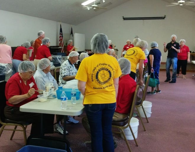 Volunteers put meals together in September in preparation for the local Stop Hunger Now packaging campaign on Sunday.