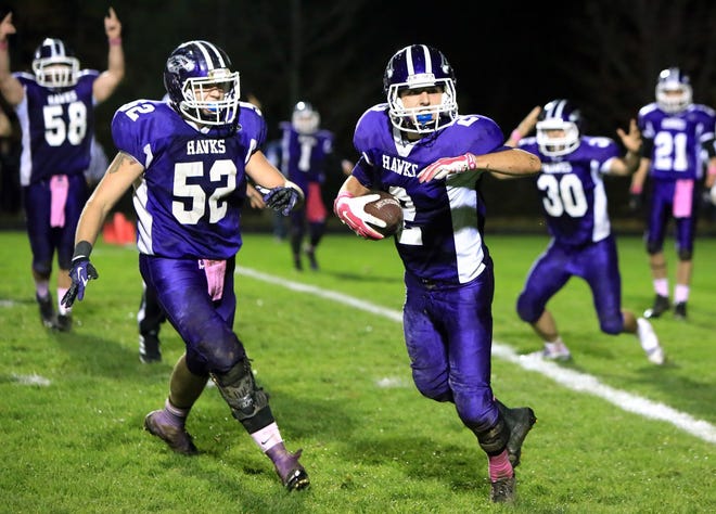Marshwood’s Ryan O’Neil (2), reacts with teammates after intercepting a pass on the 1-yard line during last month’s game with York in South Berwick, Maine.