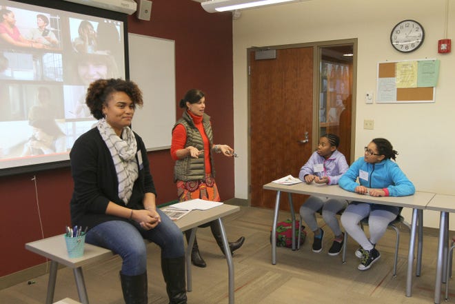 Jasmine Meade, left, who teaches sixth grade at the Wheeler School, and Lupe Vivier, who teaches nursery school through fifth-grade Spanish, conduct a Beauty in My Skin Workshop at Saturday's Diversity Conference at the Wheeler School, in Providence.
