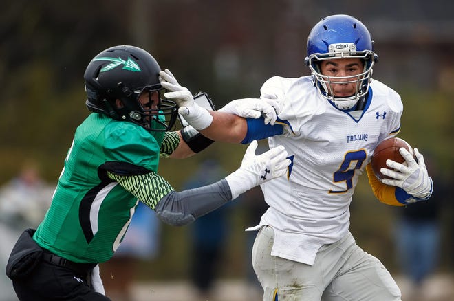Maroa-Forsyth quarterback Jack Hockaday (9) puts a stiff arm on Athens' Carrigan McMahon (6) on a rush in the first half during the Class 2A quarterfinal playoffs at Athens High School, Saturday, Nov. 15, 2014, in Athens, Ill. Justin L. Fowler/The State Journal-Register