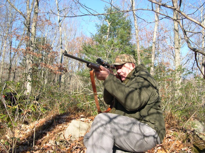 Sullivan County Court Judge Frank LaBuda aims his rifle, a bolt action Springfield, on the first day of hunting season on Saturday. LaBuda has had the rifle since he was 12 and is a longtime member of the Haven Hunt Club. Richard J. Bayne/Times Herald-Record
