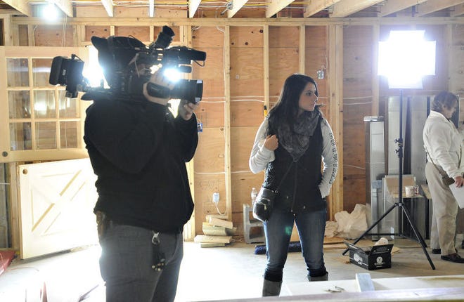 Camera operator and producer, Steven Ginsberg and Dominique Panarelli, coordinator producer look for more B-roll for the The new show for Great American Country network, "Barn Hunters," being taped in New Hope area. The idea is that they find old barns, dismantle them and recycle them into luxury custom homes.