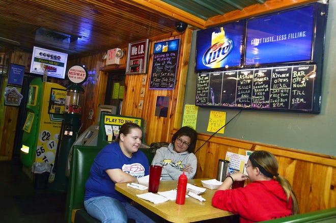 The owners of the Midway Bar & Grill in Potter Township got an offer they couldn't refuse from Shell and will be closing the bar on Friday. Customer Dorothea Georgakis, middle, from Monaca, waits for lunch with her nieces, Christina Czambel, left, and Kayla Czambel, both from Aliquippa.