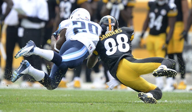 Titans cornerback Alterraun Verner intercepts a pass intended for Steelers wide receiver Emmanuel Sanders during last season's game in Pittsburgh.