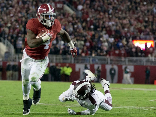 Alabama running back T.J. Yeldon (4) runs the ball against Mississippi State defensive back Jamerson Love (5) during the second half of Alabama's 25-20 victory on Saturday. Associated Press