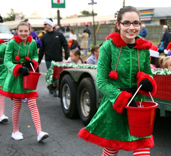 Members of Stepping Stone Dance Studio hand out candy during Bristol Township's 14th Annual Holiday Parade on Saturday.