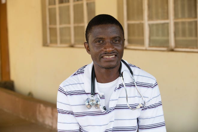 In this April 2014, file photo, provided by the United Methodist News Service, Dr. Martin Salia poses for a photo at the United Methodist Church’s Kissy Hospital outside Freetown, Sierra Leone. Nebraska Medical Center said in a news release Monday, Nov. 17, 2014, that Salia died as a result of Ebola. Salia contracted the disease while working in Sierra Leone, and he arrived Saturday to be treated at the Omaha hospital, where two other Ebola patients have been successfully treated.