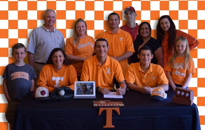 South Point senior Garrett Davila, front center, last week signed with Tennessee to play baseball.