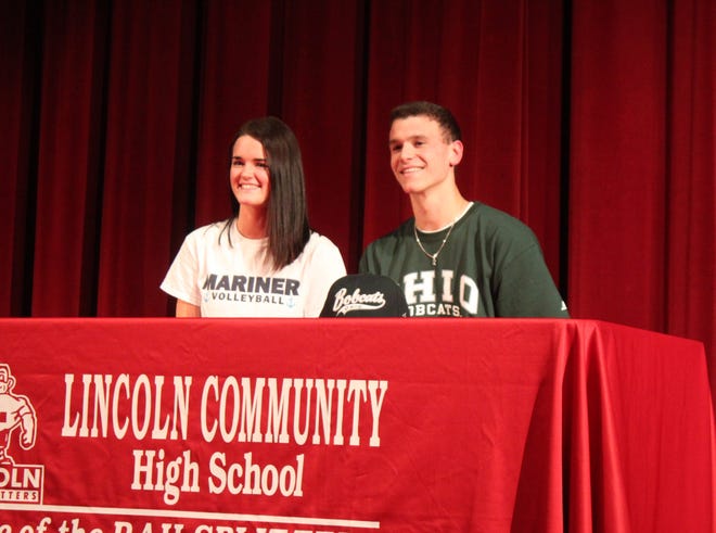 Lincoln seniors Leah Anderson and Gavin Block sit together after signing to next schools on Monday at the high school auditorium. Photo by Bill Welt/The Courier