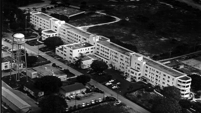 Published 2/9/92 - The A.G. Holley Hospital sprawls on 160 acres near Lantana Road and Interstate 95. The tuberculosis hospital opened in 1950 with 490 beds. Today the western half is a women’s prison, and the 46 TB patients are housed on the east end of the third floor. (Scott Wiseman / The Palm Beach Post)