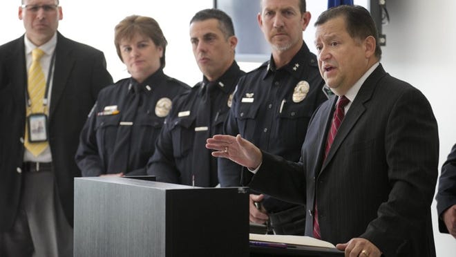 Hector Gomez, right, speaks at a news conference at the United States Courthouse to announce the end of the search of Kevin Patrick Stoeser, one of the U.S. Marshal Service’s 15 Most Wanted fugitives, on Monday November 17, 2014. JAY JANNER / AMERICAN-STATESMAN