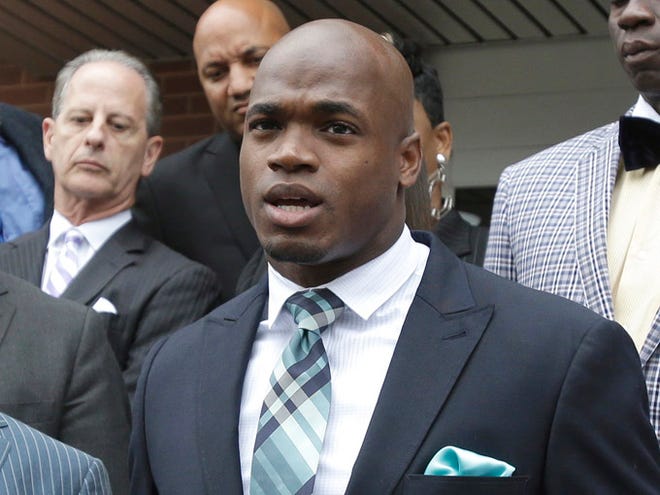 Minnesota Vikings running back Adrian Peterson speaks to the media after pleading no contest to an assault charge on Nov. 4 in Conroe, Texas. The NFL suspended Peterson without pay for at least the remainder of the season.