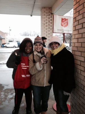 Members of the Full Gospel Evangelistic Center in Lincoln donate their time to help ring bells for the Salvation Army 2013 fundraising campaign. Photo by Tony Shuff.