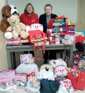 Courtesy photo

From let, Carol Lombard, Toys for Tots; Nancy Ford, finance chair of YCRC.