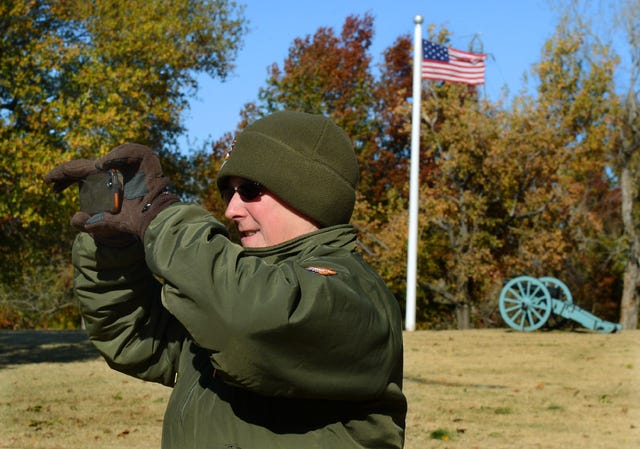BRIAN D. SANDERFORD • TIMES RECORD / Park Ranger Pat Schmidt with the Fort Smith National Historic Site takes the weekly photo for the site's Facebook page on Monday, Nov. 17, 2014. The site's grounds are open 365 days a year, while the visitors' center is open daily from 9 a.m. to 5 p.m., and closed on Thanksgiving, Christmas and New Year's Day.