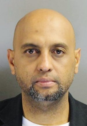 Police say Gelfi Diaz, 43, tied up a Quincy upholstery store worker during an armed robbery on Oct. 24, 2014.
